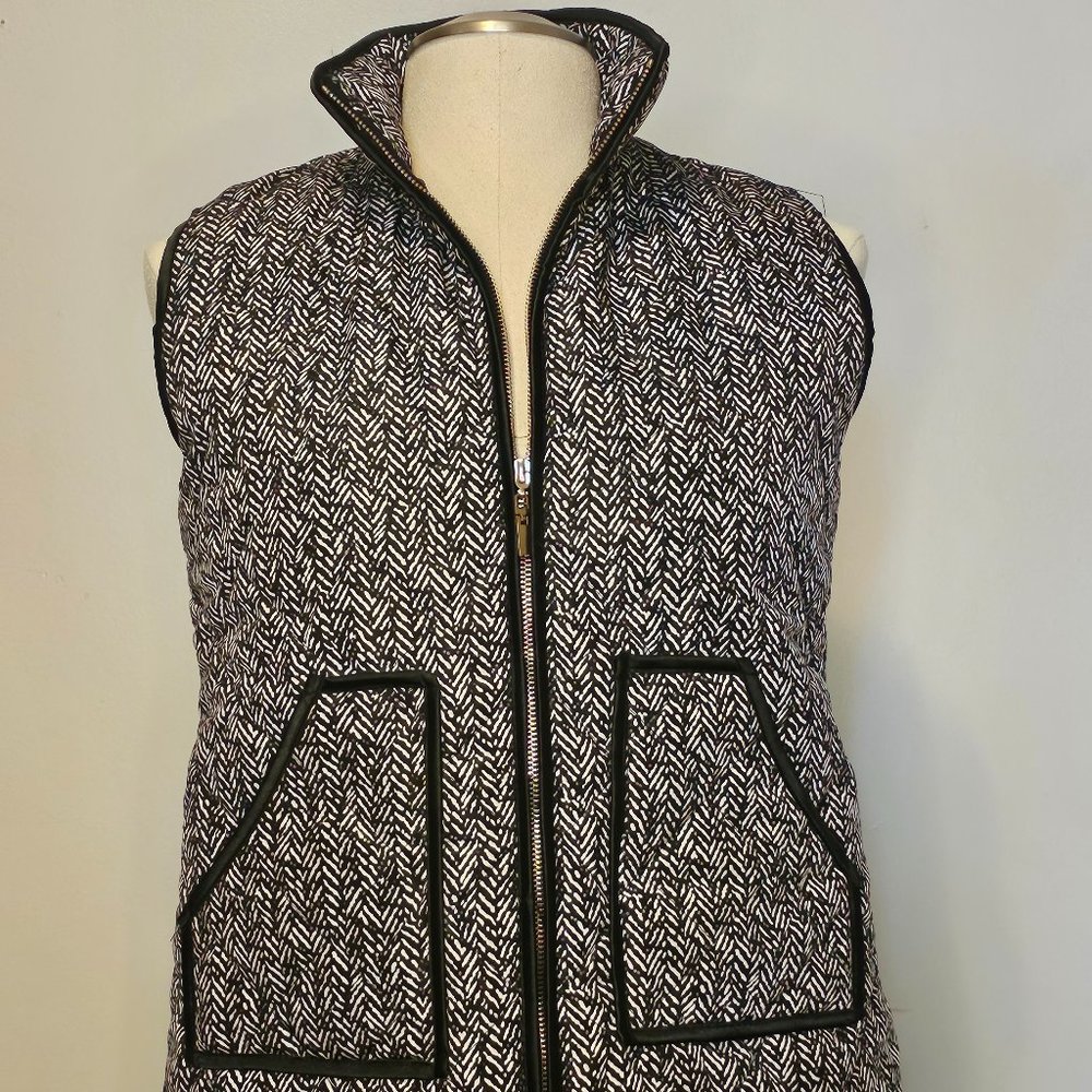 LIKE NEW Herringbone pattern puffer vest with black trim and gold zipper detail